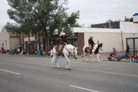 Lethbridge Whoop-Up Days parade. Cathy riding Mighty Blue N True and Bill West riding Painted Pepolena